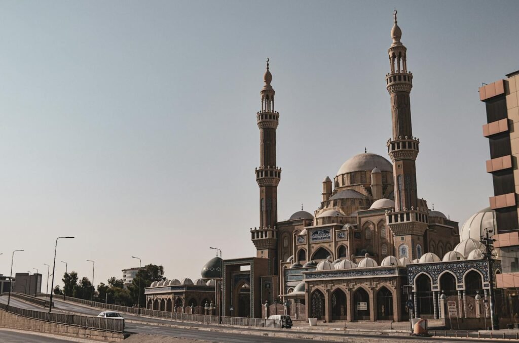 A grand mosque in Erbil, Kurdistan, Iraq, showcasing its magnificent architecture and towering minarets.